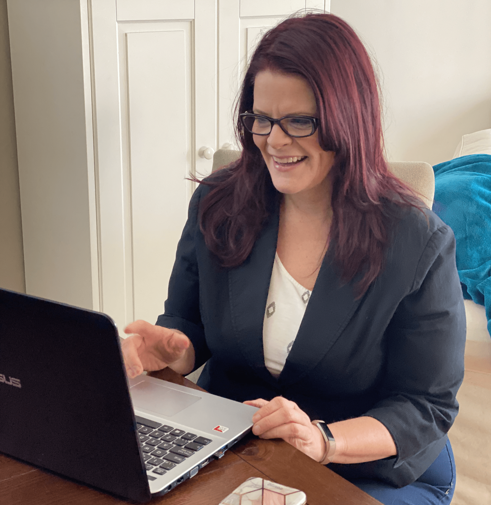 Author at table on laptop